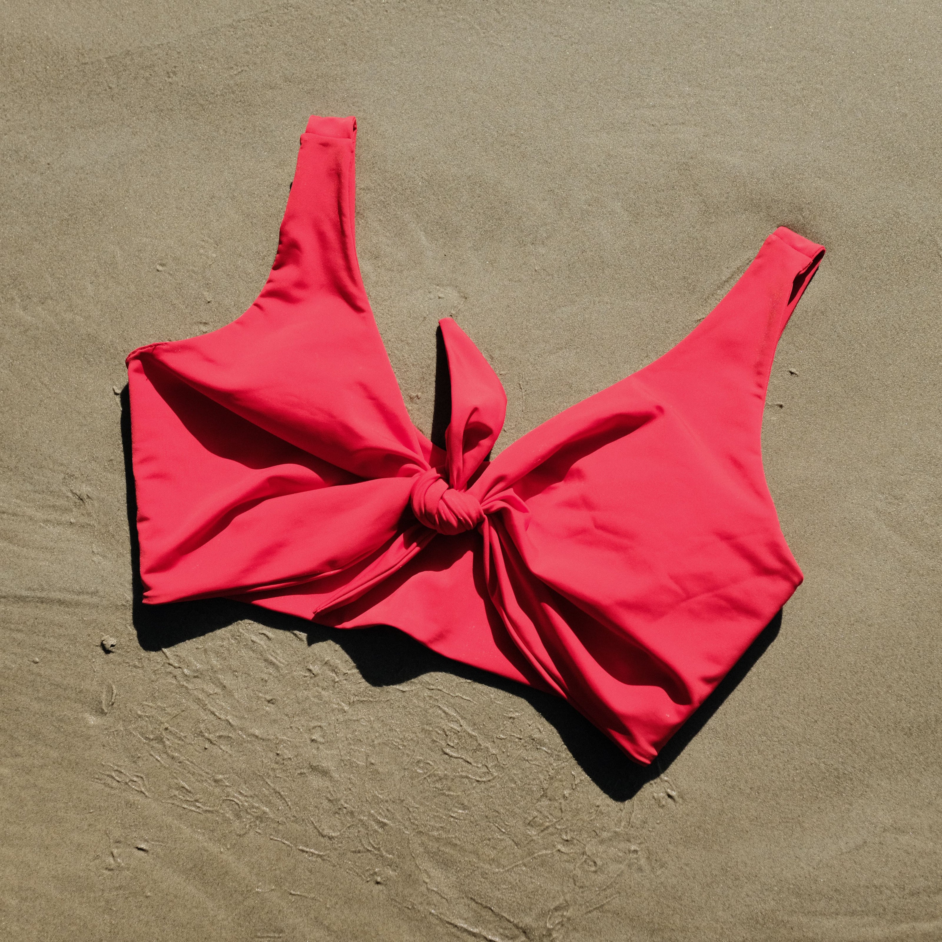 Lenny swim top in Siren colour on sand